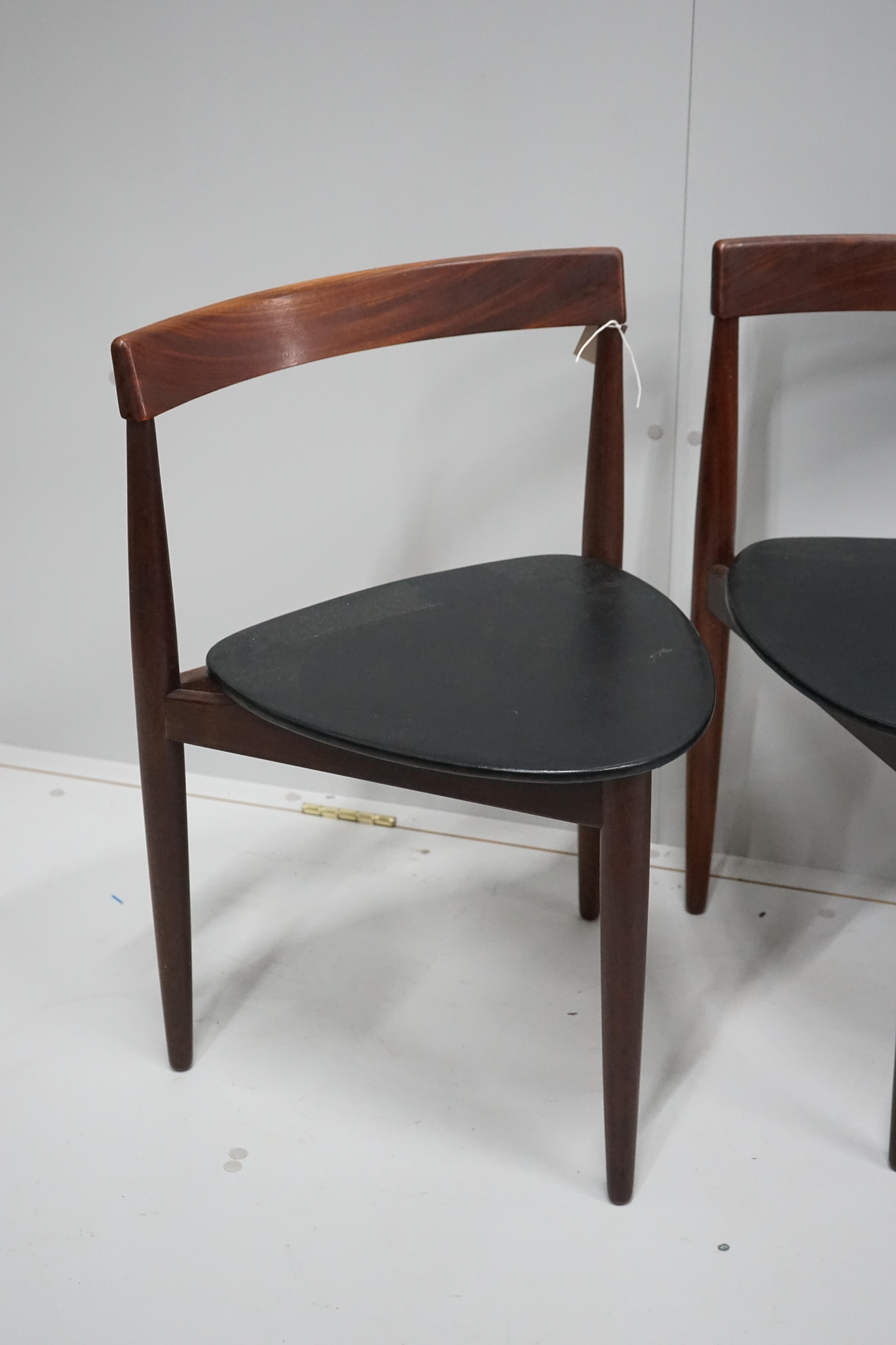 Hans Olsen for Frem Rotle, a set of four aphromosia tripod dining chairs, width 50cm, depth 41cm, height 71cm.